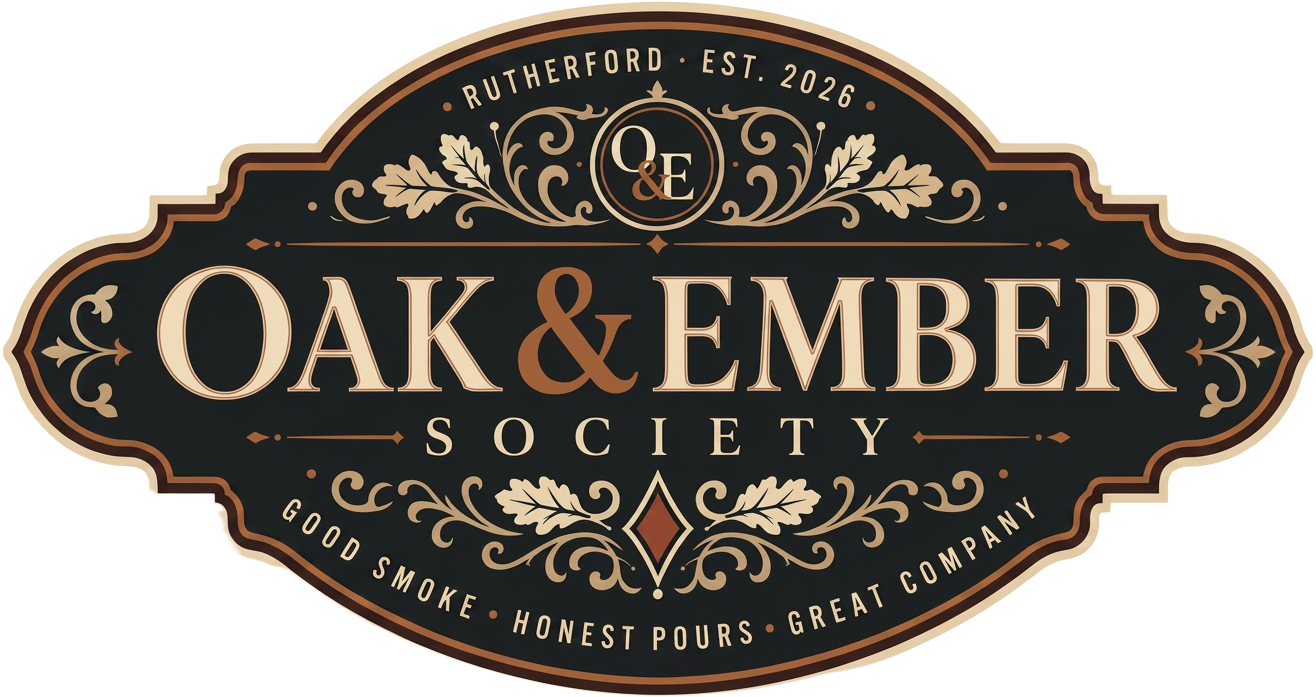 Oak & Ember Society logo — ornate vintage sign with oak leaves, Rutherford Est. 2026